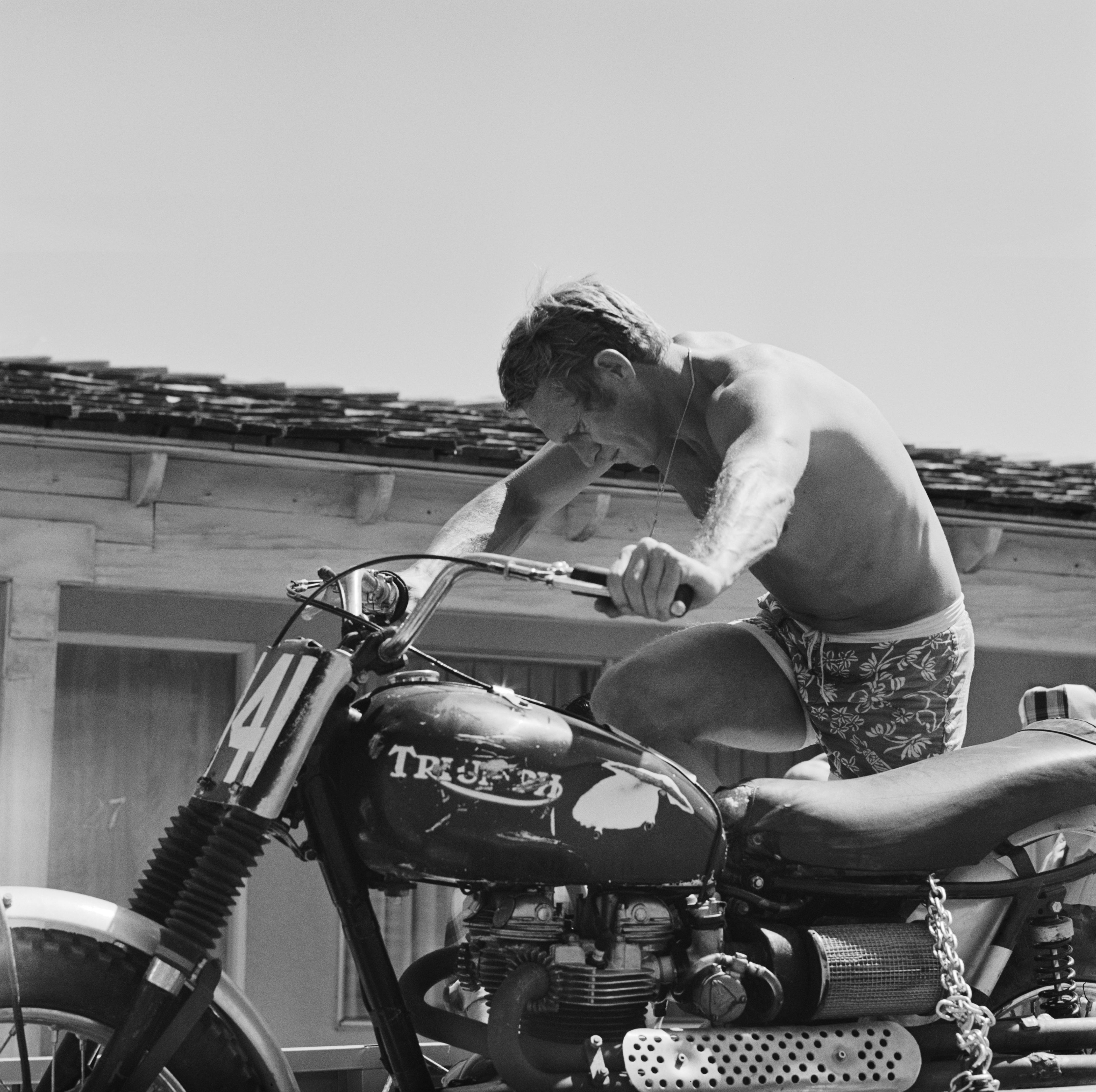 Steve McQueen riding a motorcycle